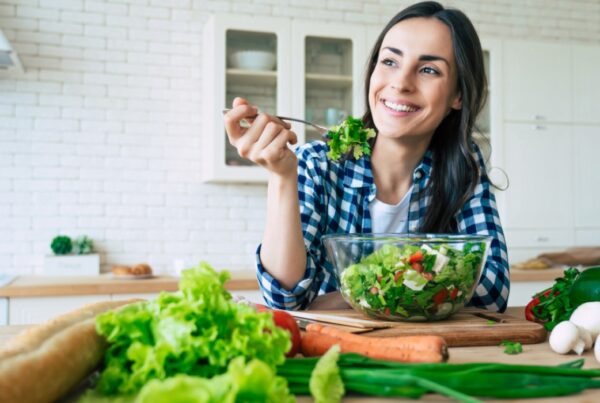 woman eating a nutrient rich salad